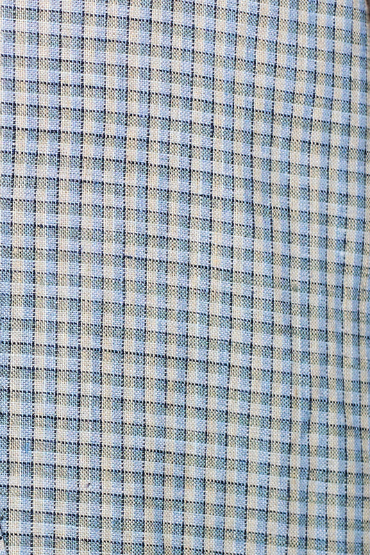 Close-up of the "linen ease trouser - field check" fabric, featuring a blue and white checkered grid. The visible weave texture gives this linen material a slightly rough look, ideal for trousers with an elastic waist.