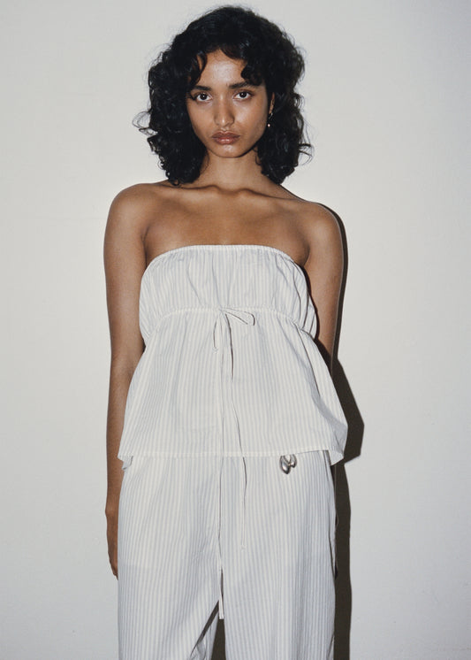 Female model wearing Strapless Cotton Top - Story Stripe by Deiji Studios against plain background