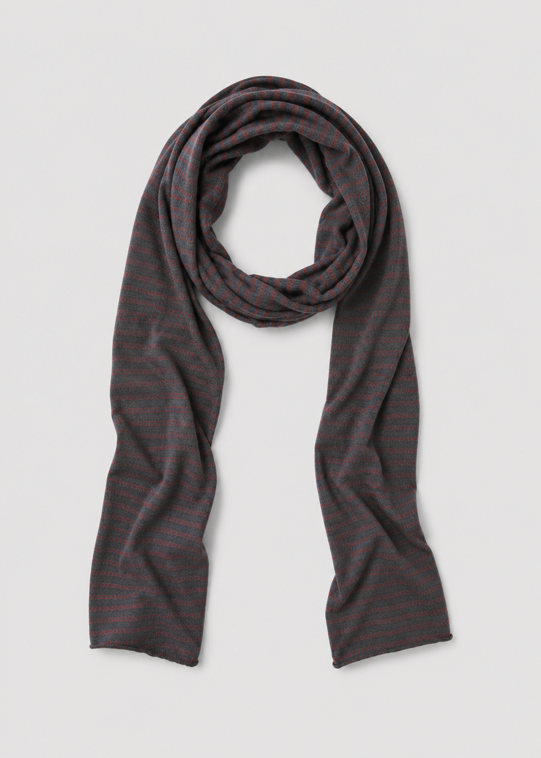The Knit Scarf - Brown Grey Stripe is a lightweight knitted scarf with a dark base and subtle thin red horizontal stripes, displayed in a loose loop on a plain white background.
